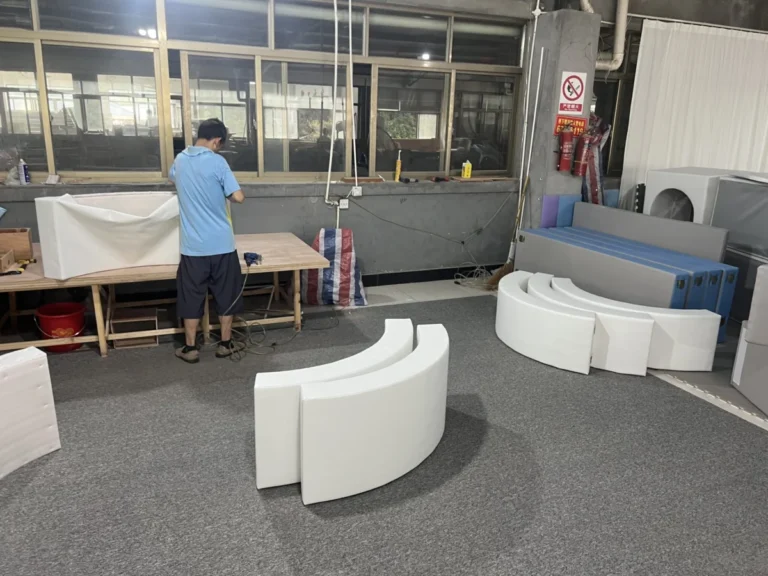 Foam shaping workshop making curved soft play modules