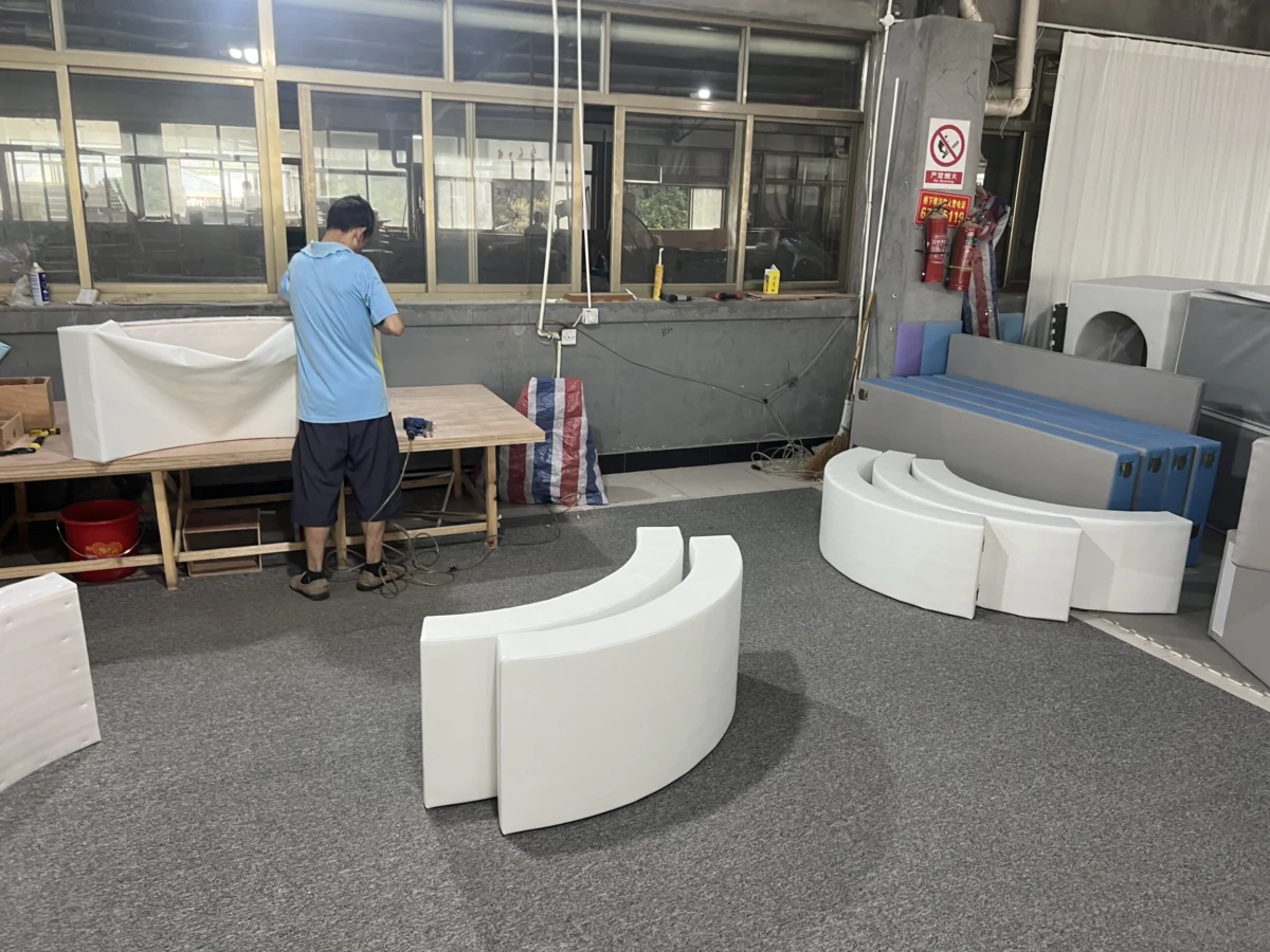 Foam shaping workshop making curved soft play modules in the PlayCurator factory