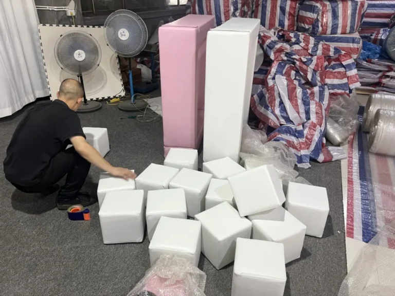 Worker checking foam cubes for soft play equipment