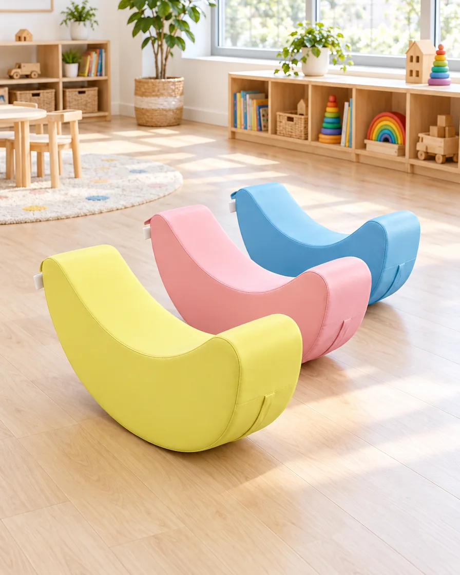 PlayCurator Crescent Soft Play Rocker — Pastel 1 Pastel crescent Soft Play Rocker in a kindergarten playroom indoor playground