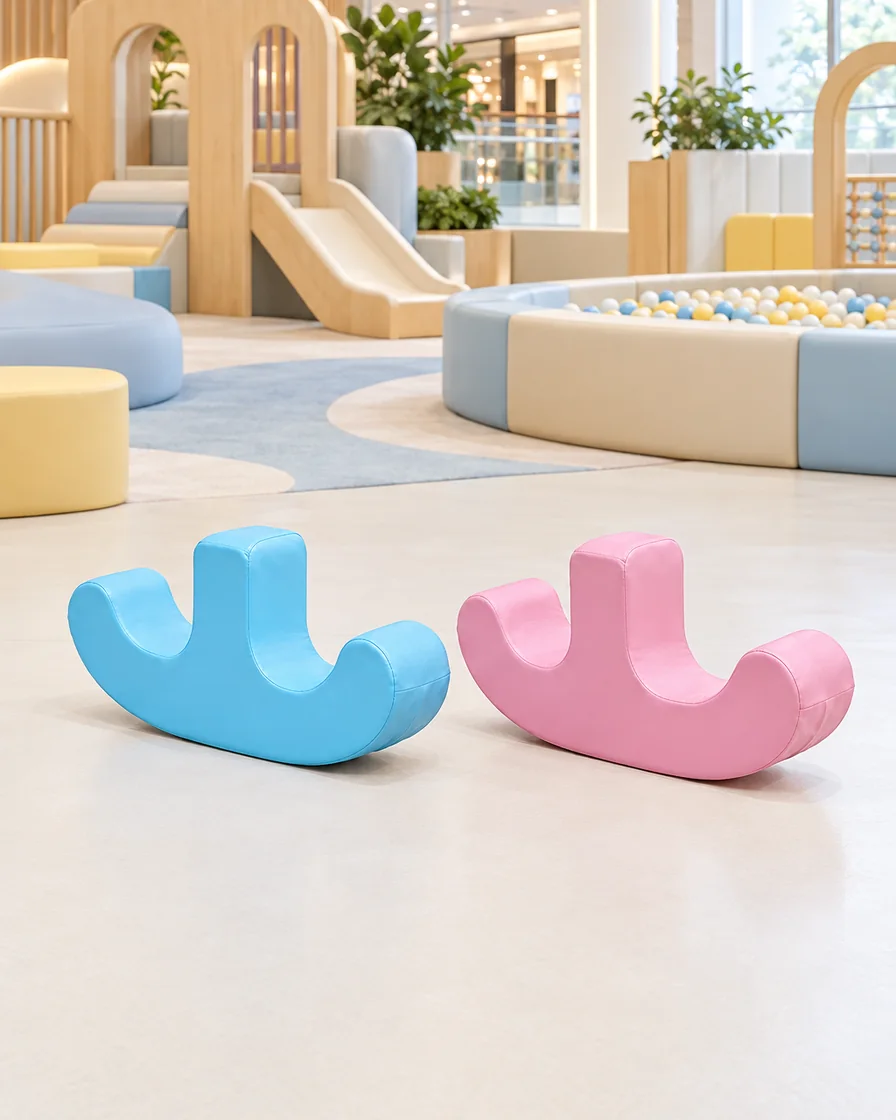 PlayCurator Double-Seat Soft Play Rocker — Blue & Pink 1 Blue & Pink double-Seat Soft Play Rocker in a mall play zone indoor playground