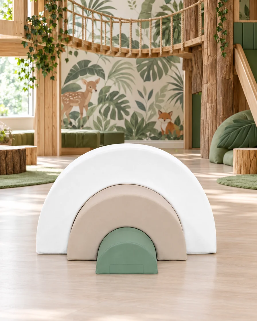PlayCurator Nested Rainbow Soft Play Arches — White, Beige & Sage 1 White, Beige & Sage nested Rainbow Soft Play Arches in a jungle theme indoor playground