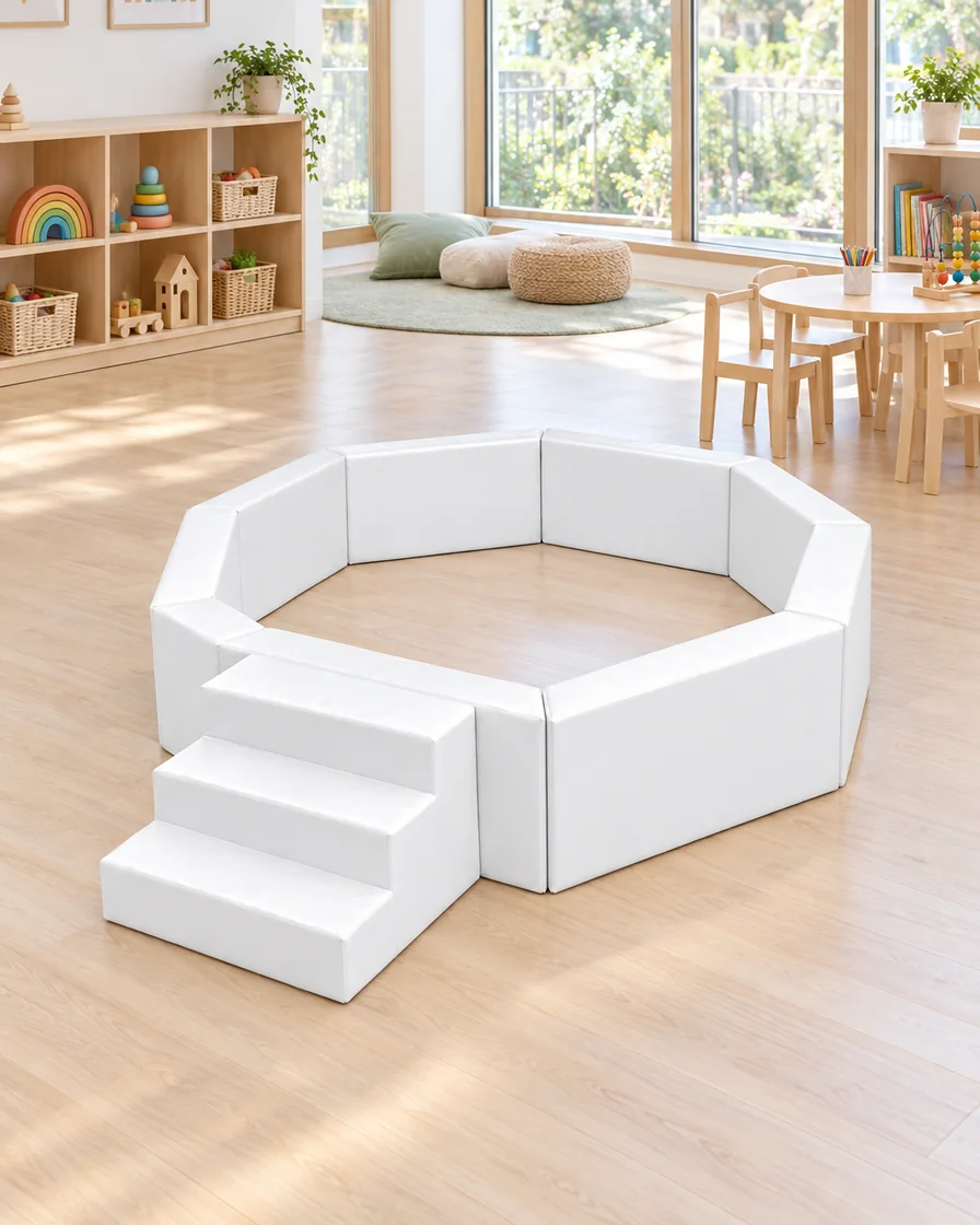 PlayCurator Octagonal Soft Play Ball Pit with Steps — White 1 White octagonal Soft Play Ball Pit with Steps in a kindergarten playroom indoor playground
