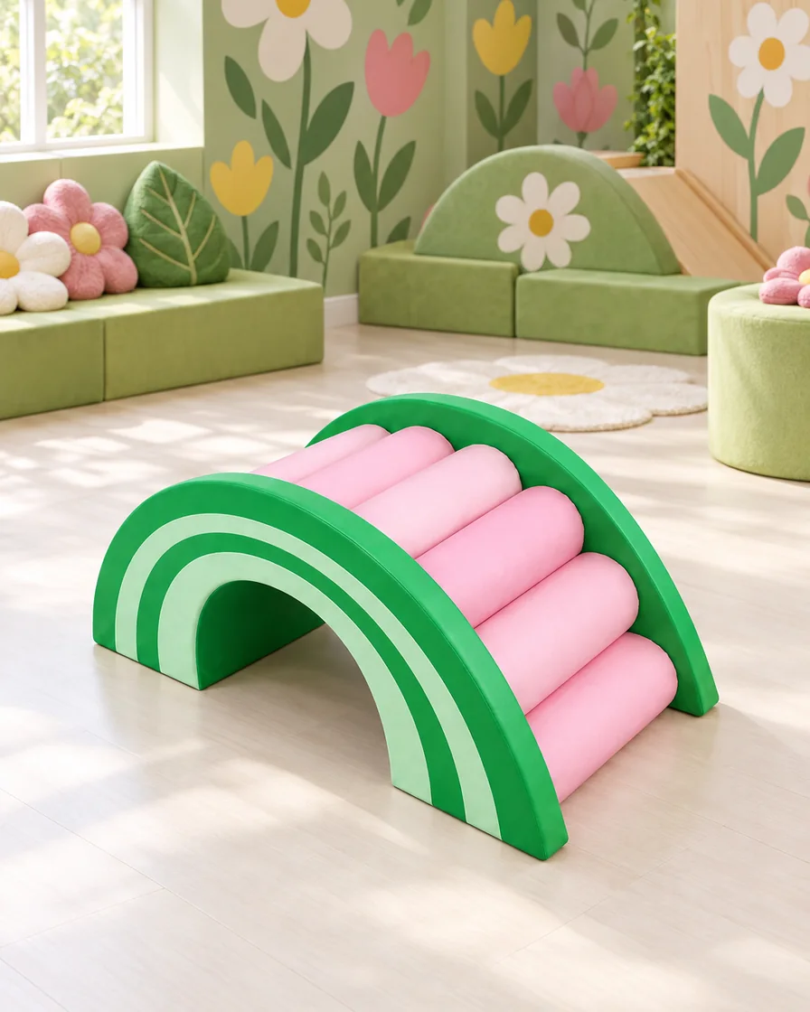 PlayCurator Rainbow Roller Soft Play Bridge — Green & Pink 1 Green & Pink rainbow Roller Soft Play Bridge in a garden theme corner indoor playground