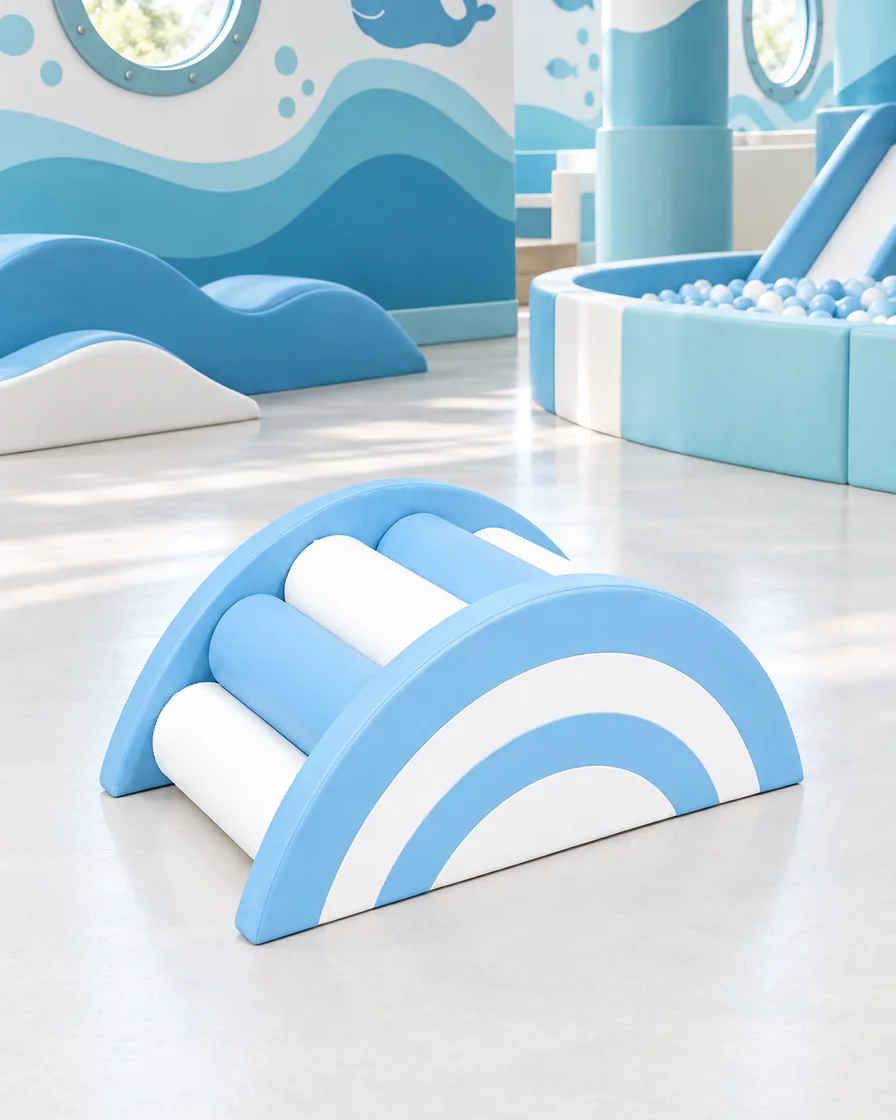 PlayCurator Rainbow Roller Soft Play Bridge — Sky Blue & White 1 Sky Blue & White rainbow Roller Soft Play Bridge in a ocean theme indoor playground