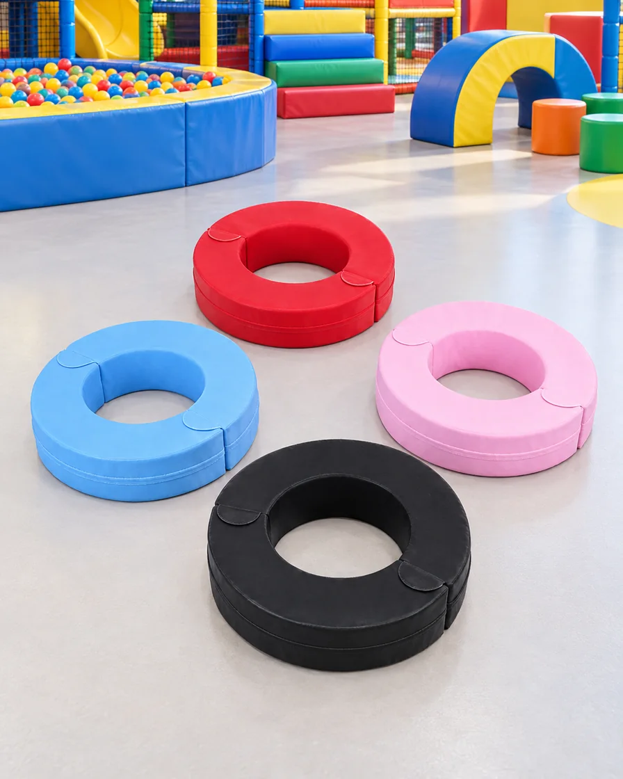 PlayCurator Ring Soft Play Seat Cushion — Blue, Red, Pink & Black 1 Blue, Red, Pink & Black ring Soft Play Seat Cushion in a family entertainment center indoor playground