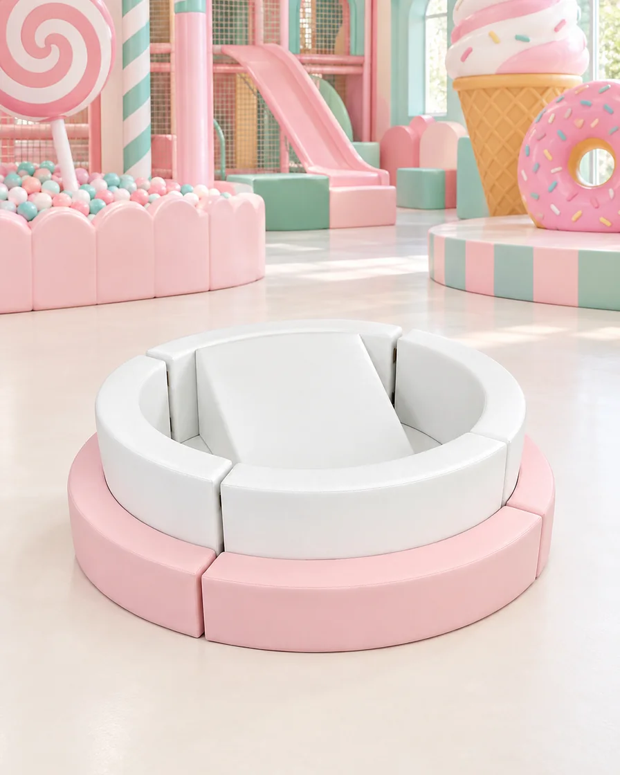 PlayCurator Round Soft Play Sofa — Pink & White 1 Pink & White round Soft Play Sofa in a candy theme indoor playground