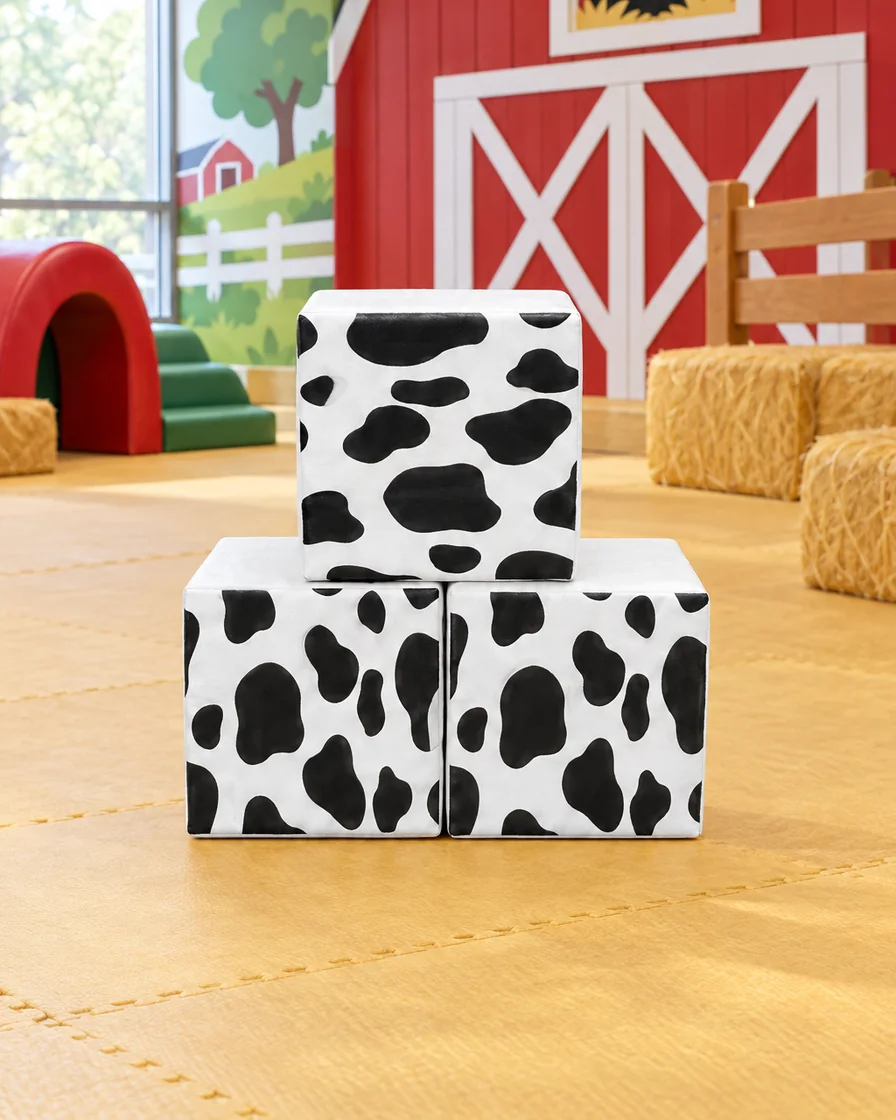 PlayCurator Soft Play Cube, 30 cm — White Cow Print 1 White Cow Print soft Play Cube, 30 cm in a farm theme corner indoor playground