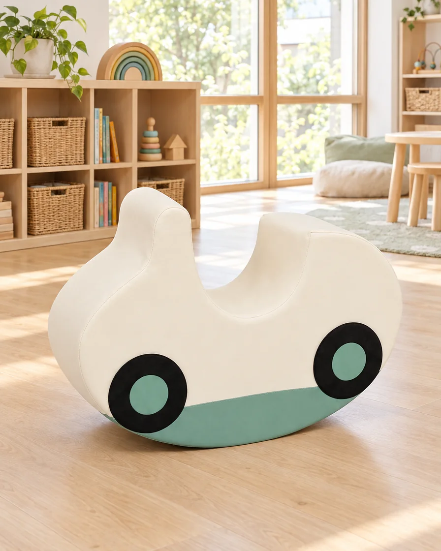 PlayCurator Soft Play Rocking Car — Cream & Sage 1 Cream & Sage soft Play Rocking Car in a kindergarten playroom indoor playground
